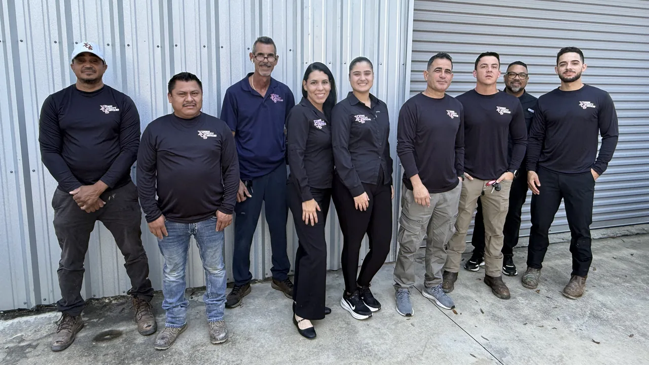Nine members of the XQS team together